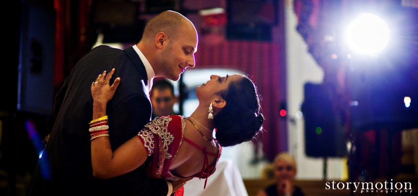 A couple shares a first dance at a fusion wedding