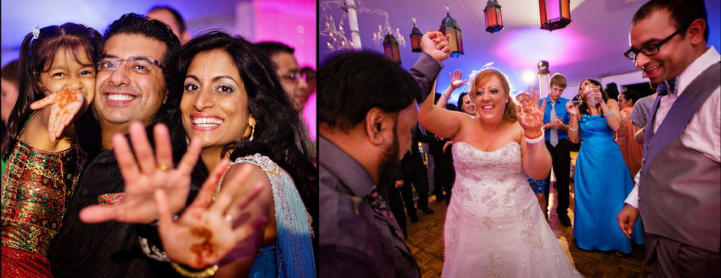 Guests showing mehndi-painted hands and a bride dancing