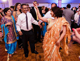 Guests dancing with an MC at a wedding reception